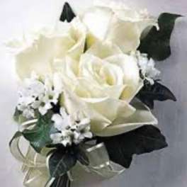 White rose bouquet with small white filler flowers and dark ribbon