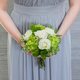 Bridal bouquet of white roses and green hydrangeas