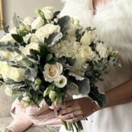 White bridal bouquet with roses and hydrangeas