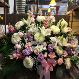 Large mixed bouquet with white lilies, chrysanthemums, and pink flowers
