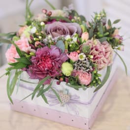 Mixed pink and lavender bouquet in a white gift box