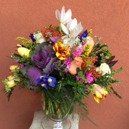 Colorful mixed bouquet in a clear glass vase