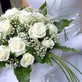 White rose bridal bouquet with baby's breath and greenery