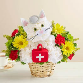 Cat-shaped floral basket with white blooms, yellow daisies, and red carnations