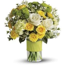 Yellow and white rose bouquet in a clear glass vase