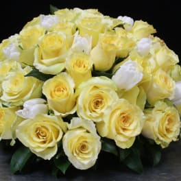 Bouquet of pale yellow roses with white tulips