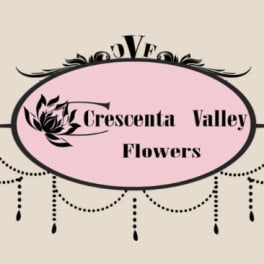 Pink oval florist logo with black decorative flourishes and text