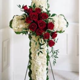 Cross-shaped floral standing spray with red roses and white flowers