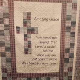 Quilted wall hanging with a cross and the words "Amazing Grace"