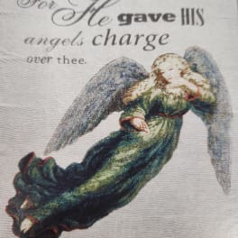 Angel illustration with text on a fabric panel