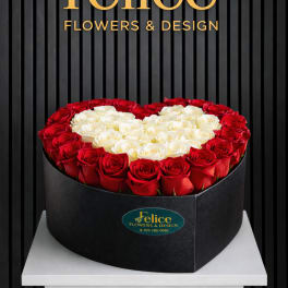 Heart-shaped box of red and white roses