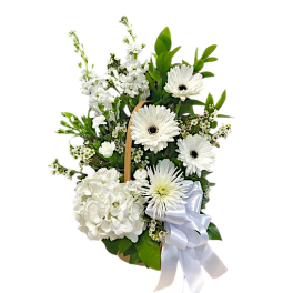 White floral basket arrangement with gerbera daisies and hydrangea