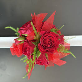 Red rose wrist corsage with white ribbon and red tulle accents