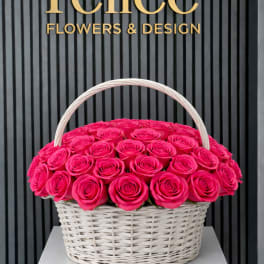 Basket of bright pink roses with a white handle