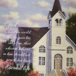 Church building with a Bible verse over a cloudy sky background