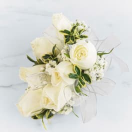 Bouquet of white roses with sheer ribbon and variegated greenery