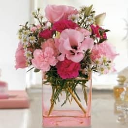 Pink bouquet in a square glass vase
