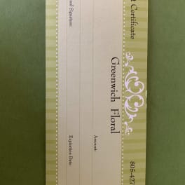 Greenwich Floral gift certificate card on a green background