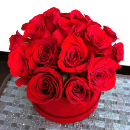 Red rose bouquet in a round red box