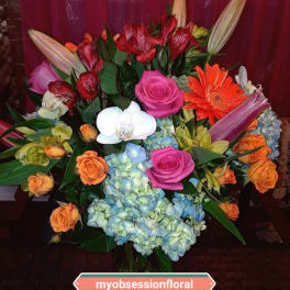 Mixed bouquet with roses, orchids, lilies, gerbera daisies, and hydrangeas