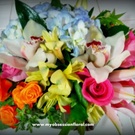 Mixed bouquet with roses, lilies, hydrangeas, and orchids