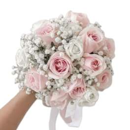 Round bouquet of pale pink and white roses with baby's breath, held in one hand