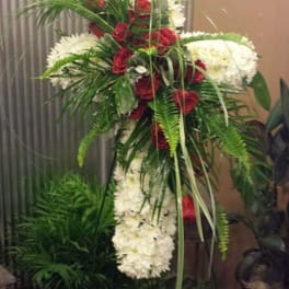 Tall standing floral spray with red roses and white flowers