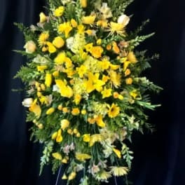 Tall yellow floral standing spray on an easel