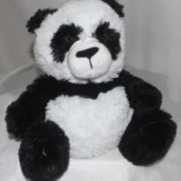 Black-and-white plush panda bear sitting upright