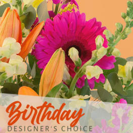 Bright mixed bouquet with a pink gerbera daisy and orange lilies