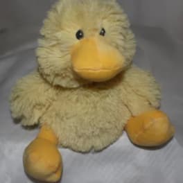Plush yellow duck toy with orange beak and feet