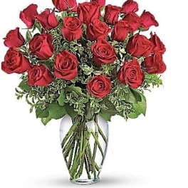 Arrangement of red roses in a clear glass vase
