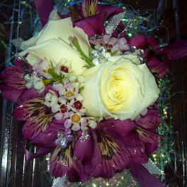 White roses with purple alstroemeria in a clear gift box