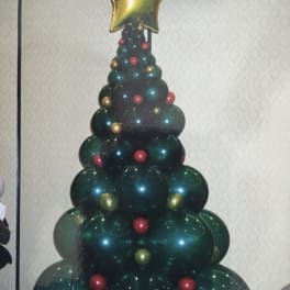 Balloon Christmas tree topped with a gold star