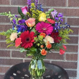 Colorful mixed bouquet in a clear glass vase