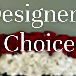 Red roses above a white floral arrangement with the words "Designer’s Choice" overlaid.