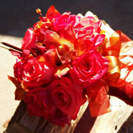 Bouquet of red roses with orange ribbon accents