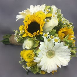 Bouquet of sunflowers, white daisies, and white roses