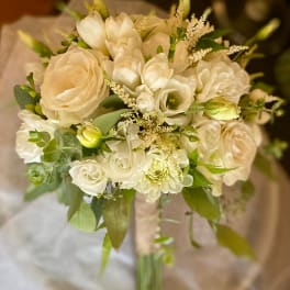 Cream and white bridal bouquet with roses and small white blooms