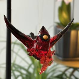 Red glass bird ornament with outstretched wings