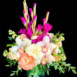 Mixed bouquet with pink and white flowers in a green vase
