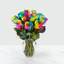 Bouquet of multicolored roses in a clear glass vase