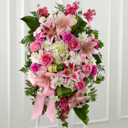 Pink and white floral standing spray with lilies and roses
