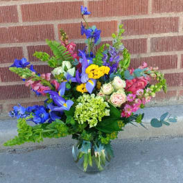 Colorful mixed bouquet in a clear glass vase