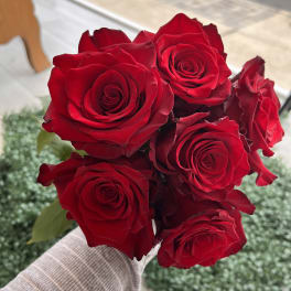Handheld bouquet of red roses