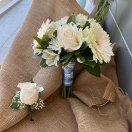 White rose and daisy bouquet with a matching boutonniere
