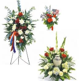 Floral standing sprays with red, white, and blue flowers and an urn centerpiece
