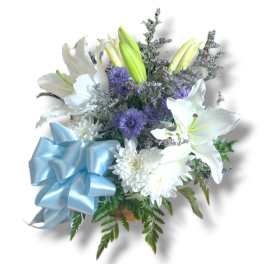 White lilies and purple flowers with a blue ribbon bow