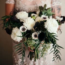 White and black bridal bouquet with anemones and roses