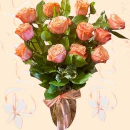 Bouquet of peach roses with a pink ribbon wrap
